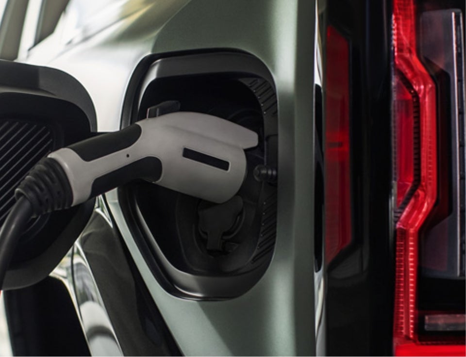 Close up of charging port with charger plugged in on a GMC Hummer EV SUV - Anderson Buick GMC in COCKEYSVILLE MD