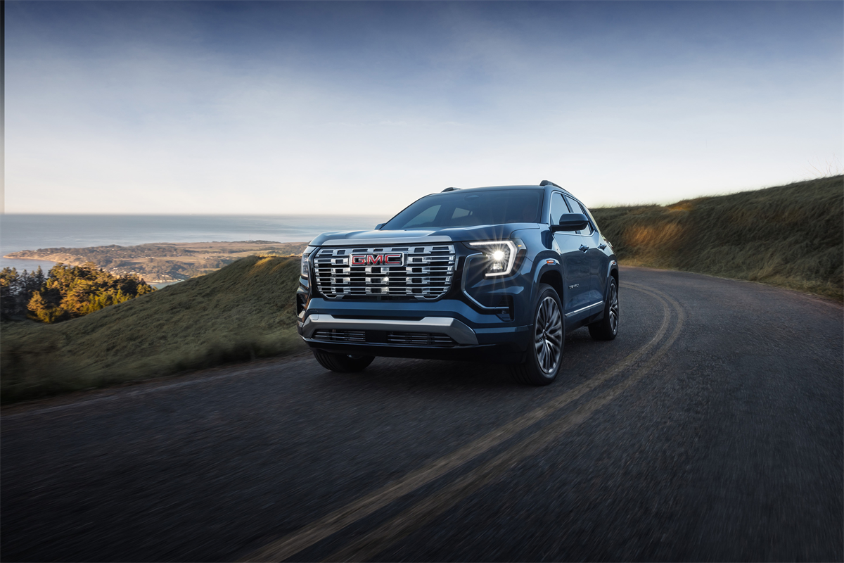 GMC Terrain driving on scenic road.