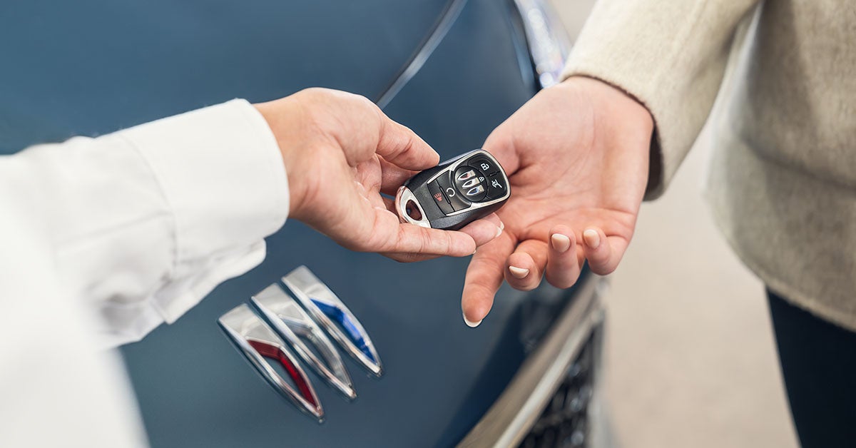 Keys handed over Buick car.