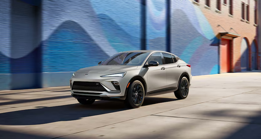 2026 Buick Envista SUV driving past colorful mural at Anderson Buick GMC of Hunt Valley